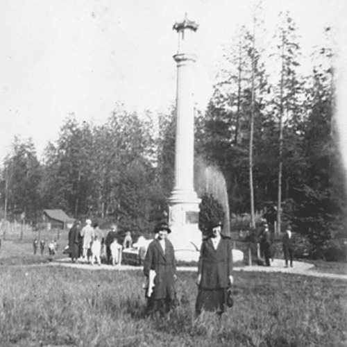 	Two Women Posing in Front of the Stanley Park Japanese Canadian War Memorial Monument; Vancouver, BC