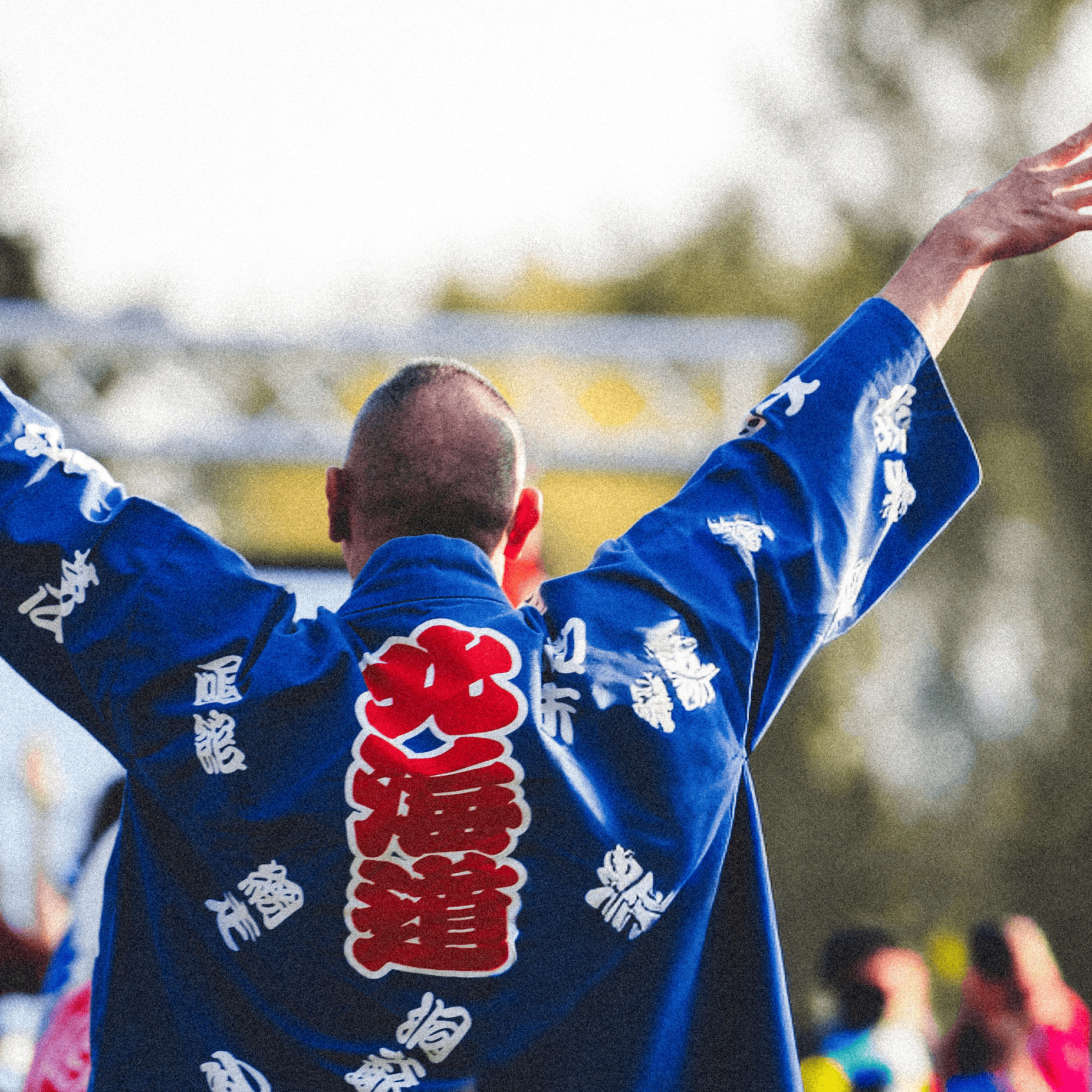 	Back view of man performing a yosakoi dance.